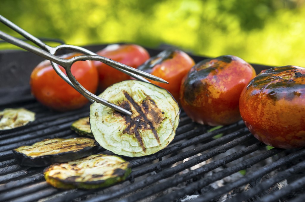 Vegetarian barbecue with tomato, eggplant, grilled on grill