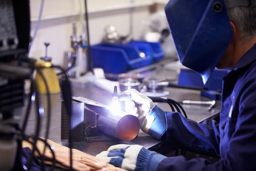 Factory Engineer Operating TIG Welding Machine