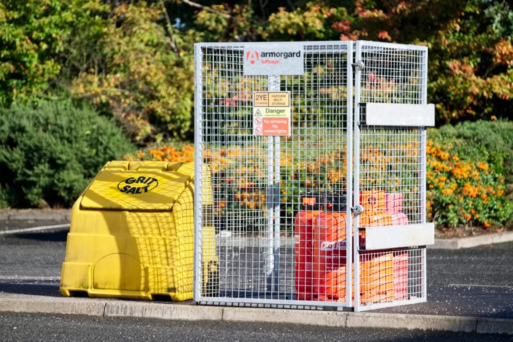 Glasgow, Scotland / UK - September 28th 2019: Highly flammable gas propane cylinders store cage for safety near construction building site and the public protection from explosion