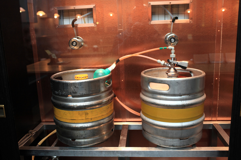 beer kegs connected to gas lines