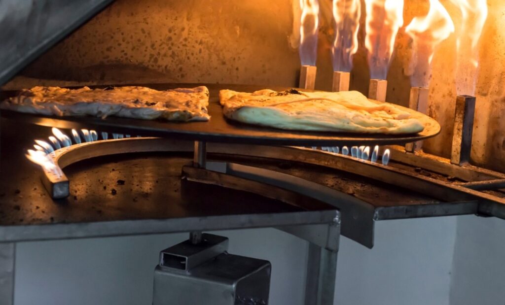 A pizza being cooked in a oven