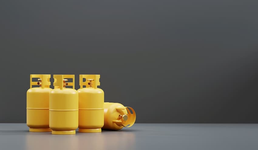 Yellow gas cylinders on a grey surface