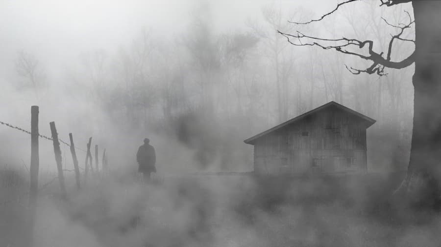 A person walking in the fog