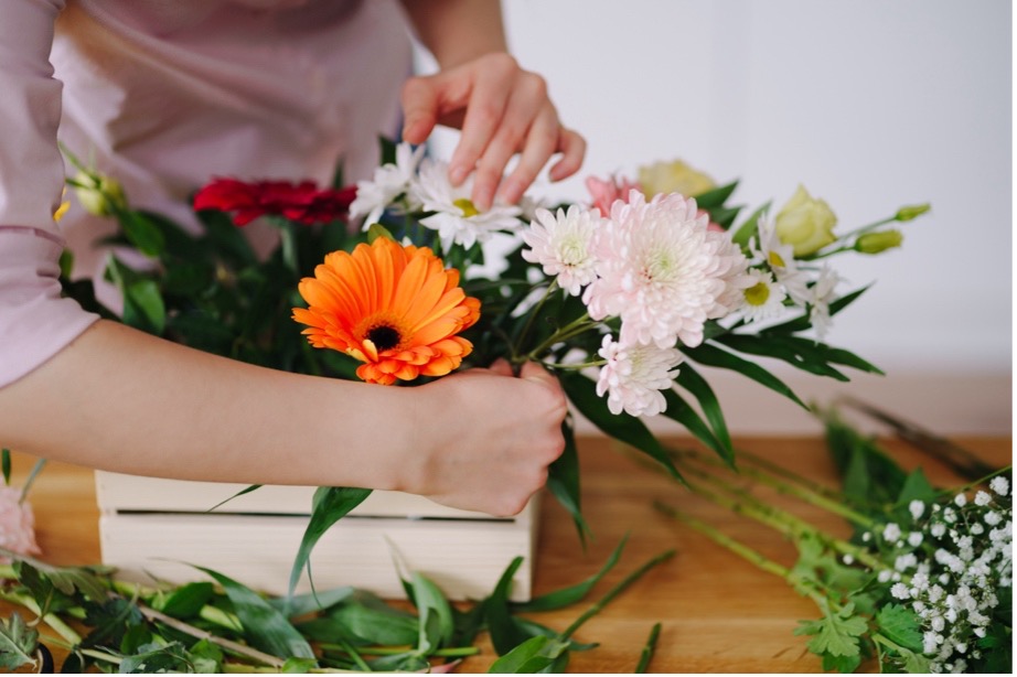 A person arranging flowers