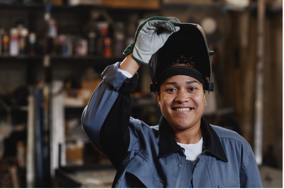 A person wearing a welding mask