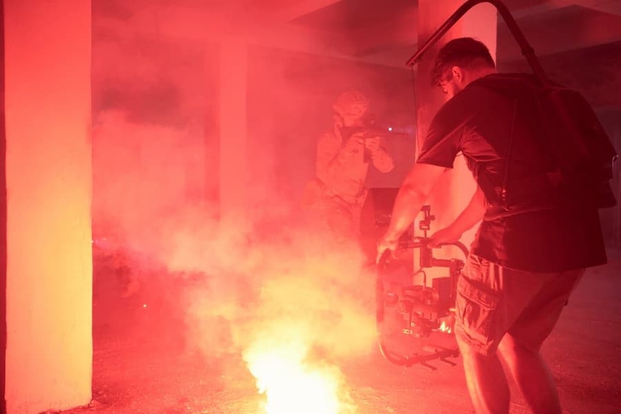 A person standing next to a fire