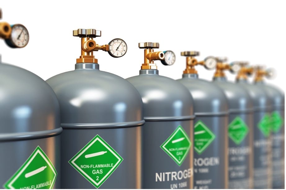 A row of grey cylinders with gauges