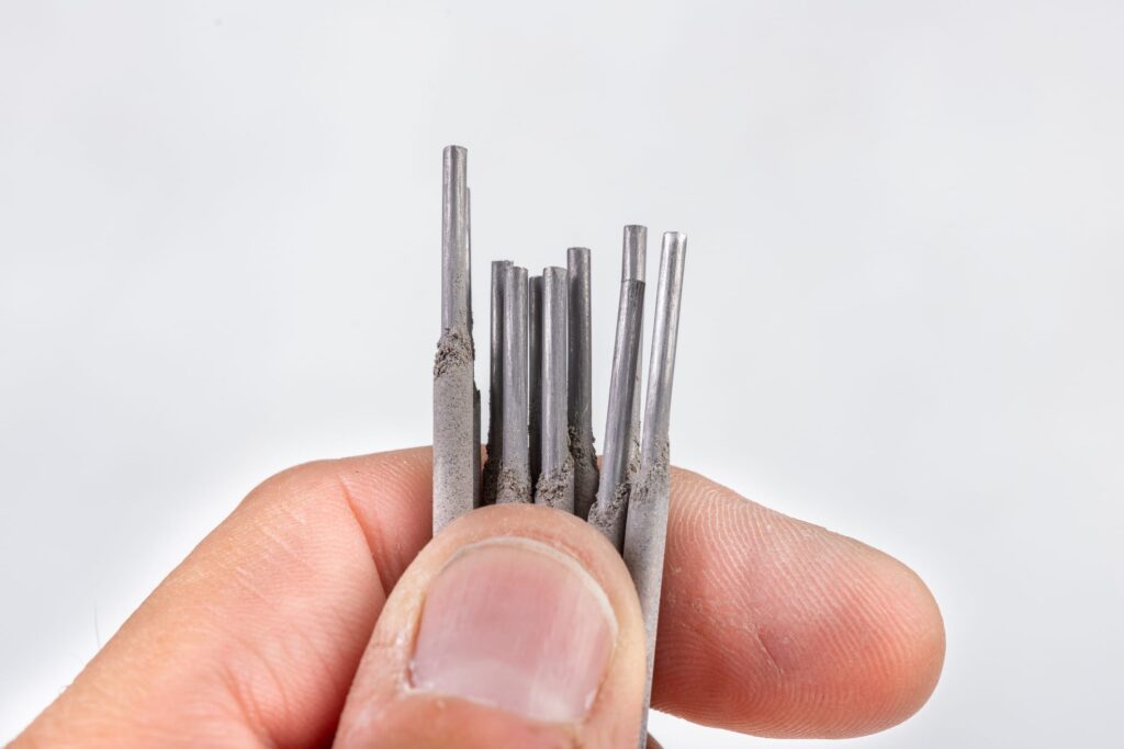 Electrodes for electric welding held in the palm of your hand. Welding accessories for MMA methods.