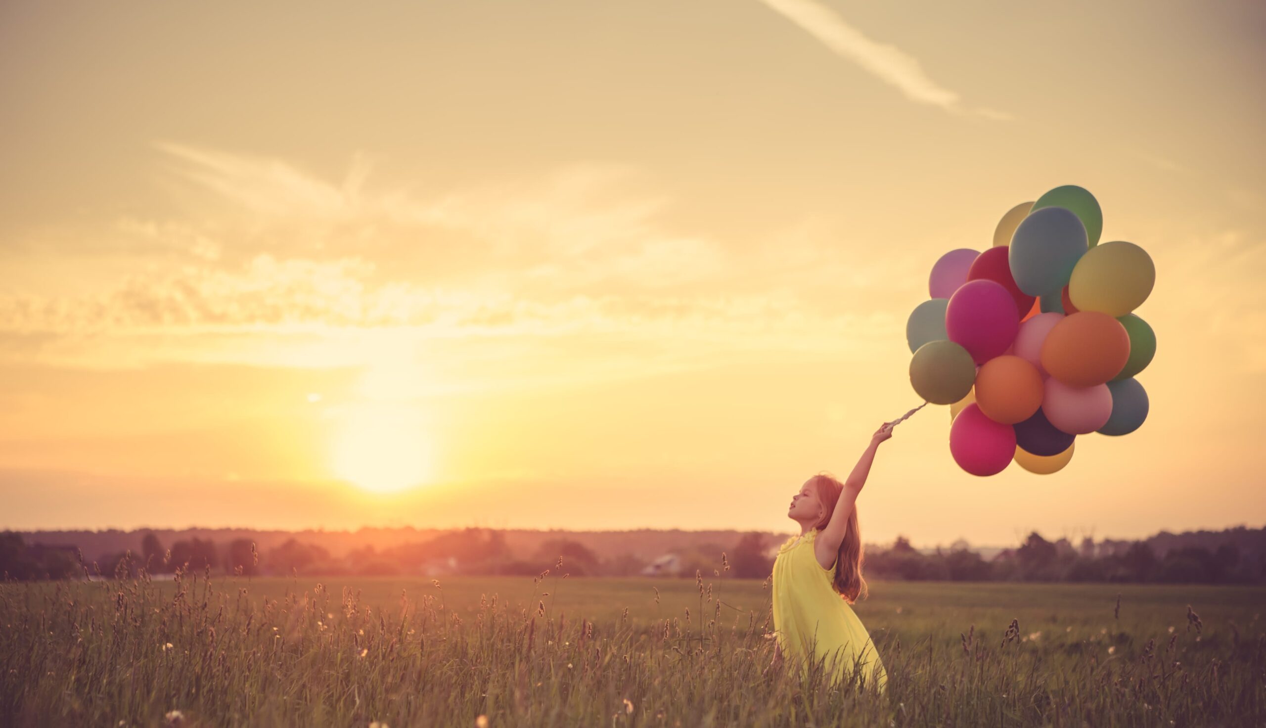 Little girl with balloons