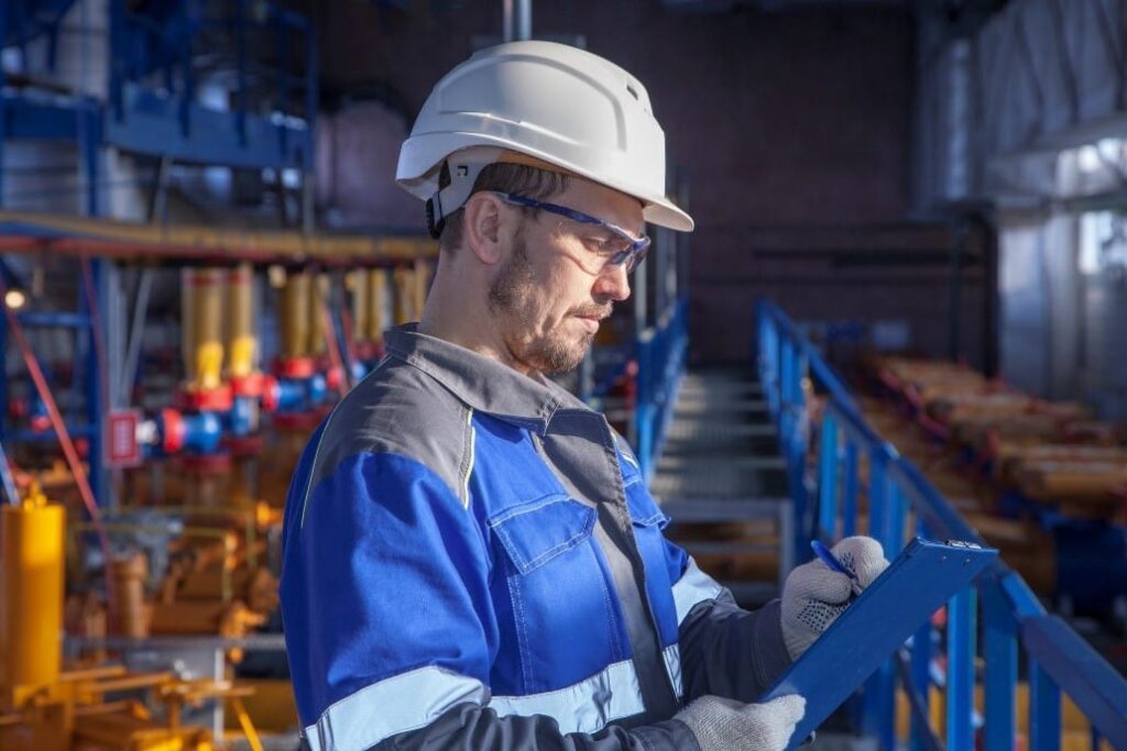 safety inspector checking gas canisters